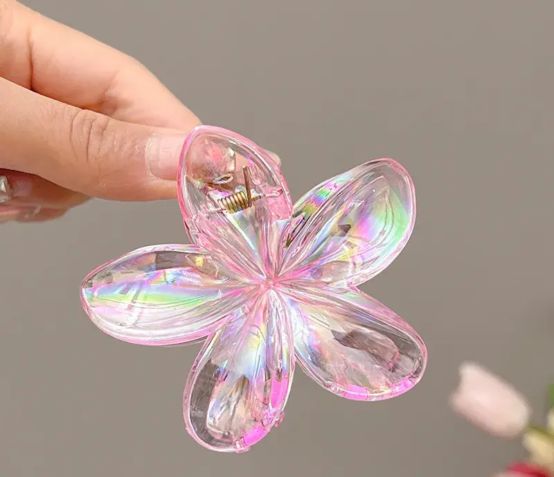 PINCE A CHEVEUX ( FLEUR DE MONOÏ ) ROSE TRANSPARENT 